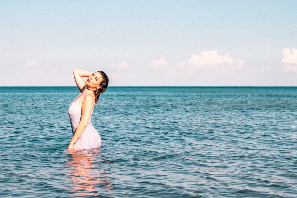 woman wearing white dress in the lake