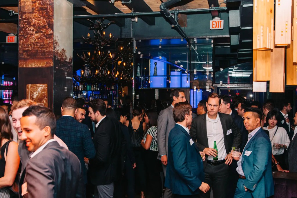 high angle view of event attendees socializing by the bar