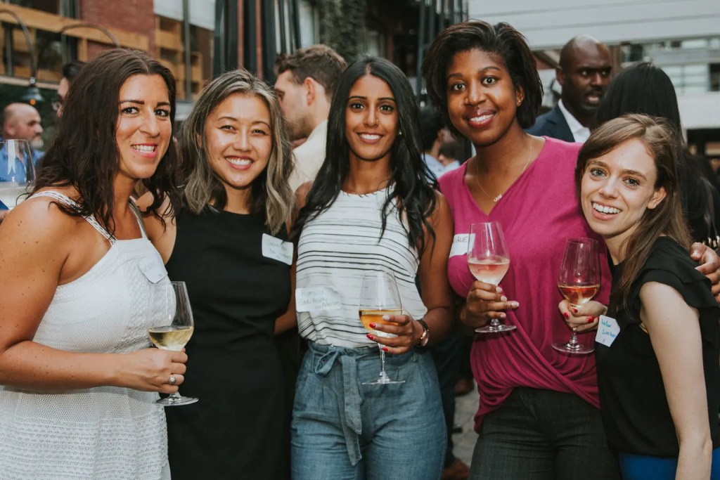 Small group of women drinking and posing